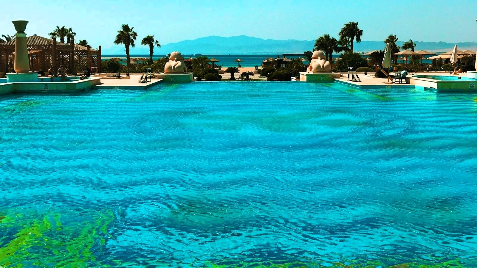 Luxurious hotel pool overlooking Antalya coastline